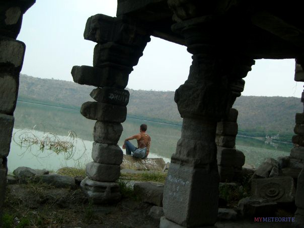 Anton Artemev at an old temple by Lonar lake