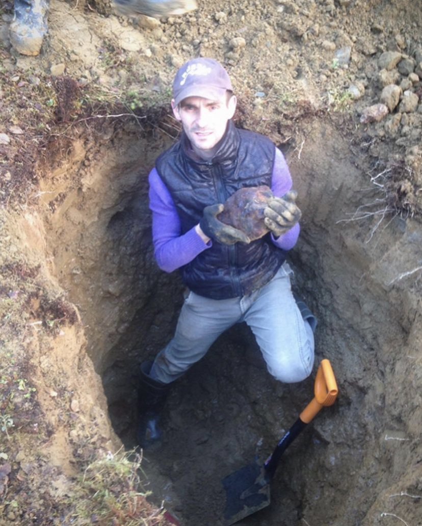Anton Artemev holding a freshly dug Muonionalusta iron meteorite, 2012