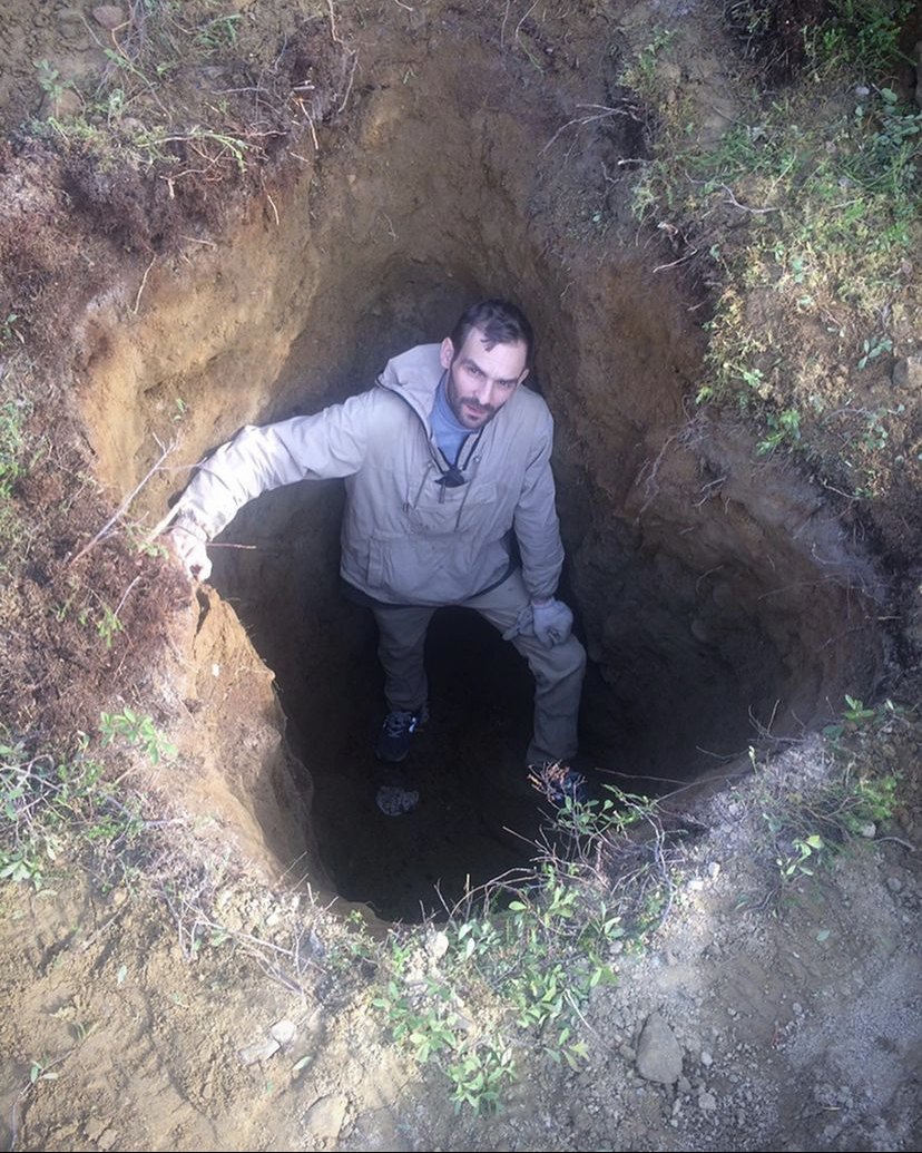 Anton Artemev in a deep excavation pit in the Muonionalusta strewn field, 2017