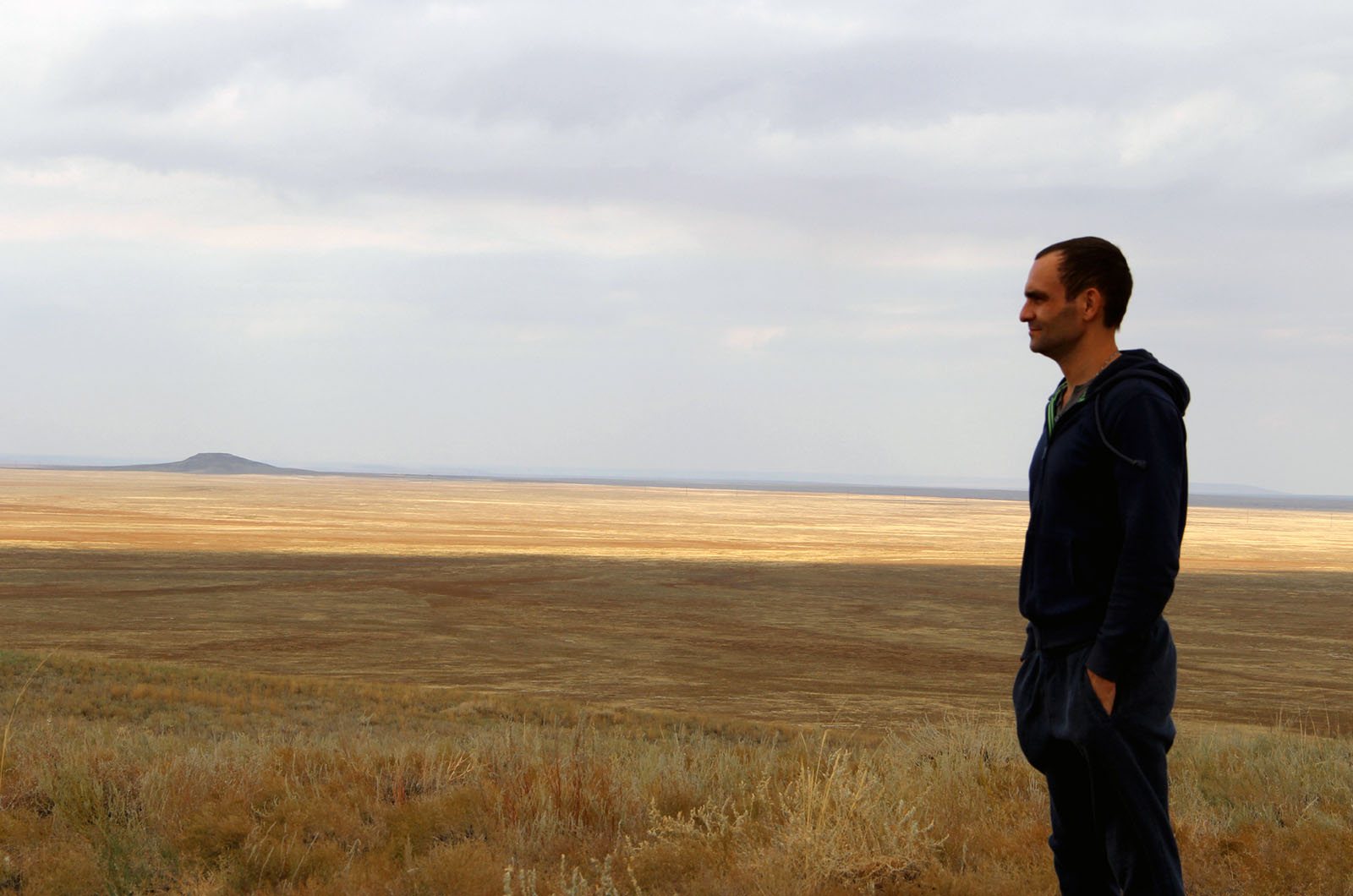 Anton Artemev overlooking the Zhamanshin meteorite impact crater, Kazakhstan